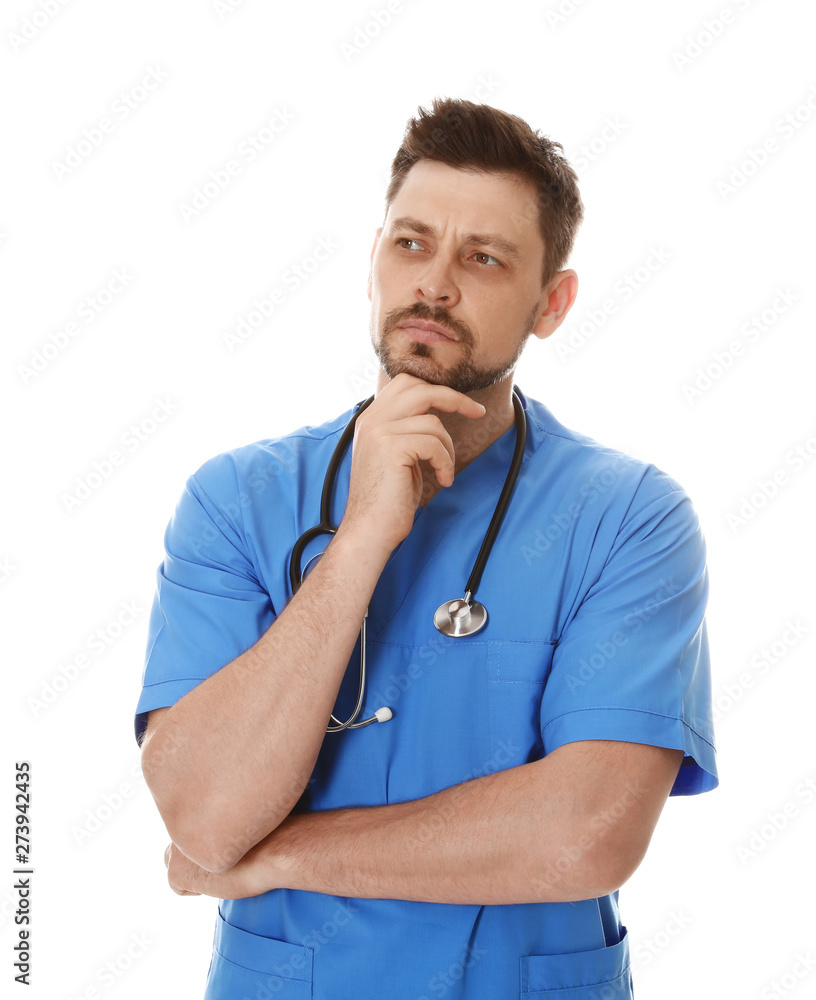 Portrait of pensive male doctor in scrubs isolated on white. Medical staff Portrait of pensive male doctor in scrubs isolated on white. Medical staff