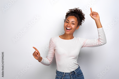 Funny woman dancing and laughing , hands up. Concept party photo