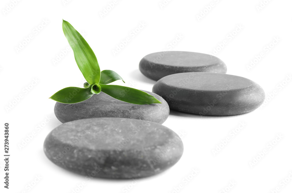 Spa stones with bamboo isolated on white Spa stones with bamboo isolated on white