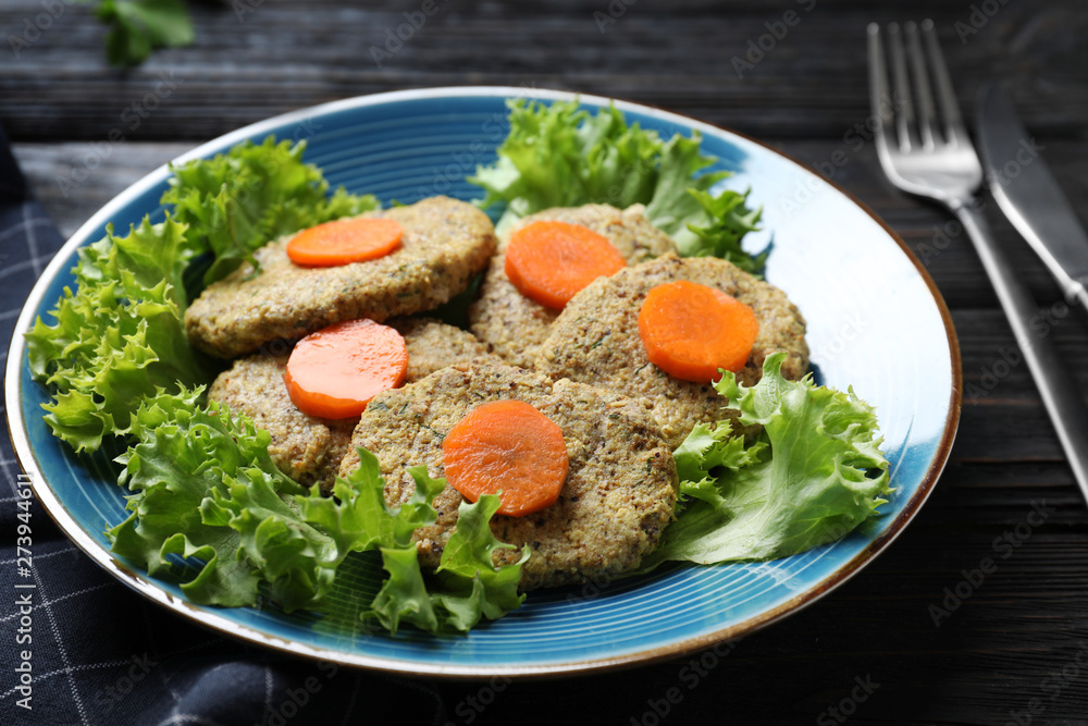 Plate of traditional Passover (Pesach) gefilte fish on wooden background, closeup Plate of traditional Passover (Pesach) gefilte fish on wooden background, closeup
