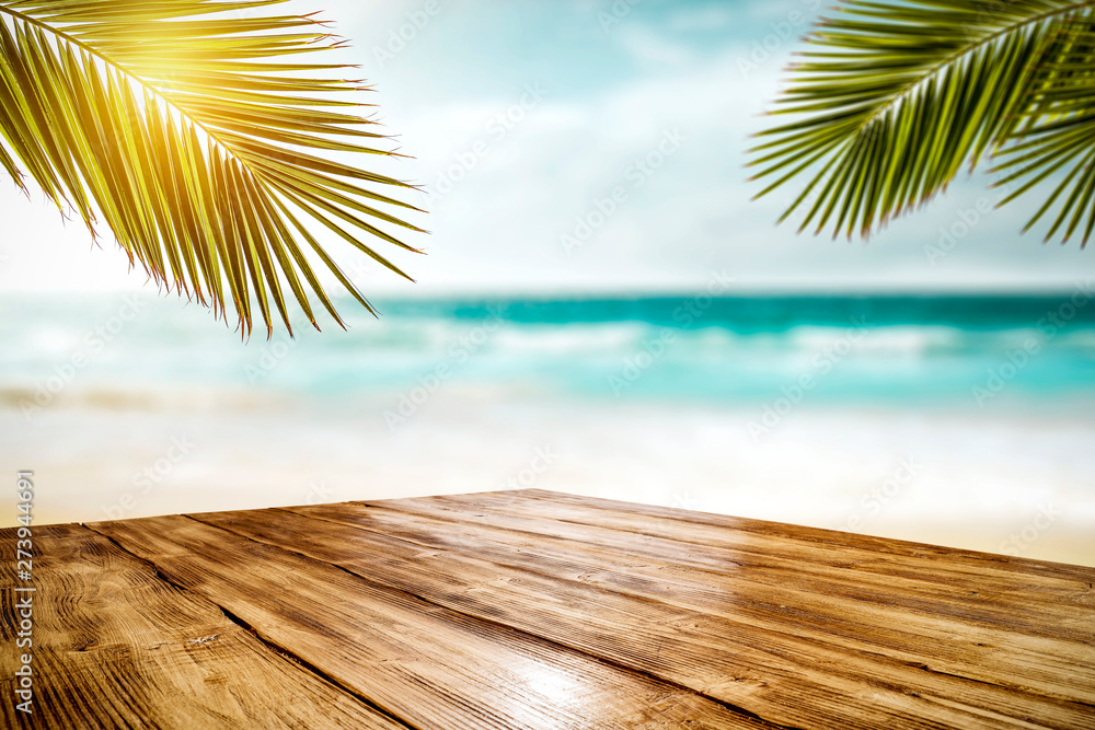 Summer desk of free space and blurred beach background Summer desk of free space and blurred beach background