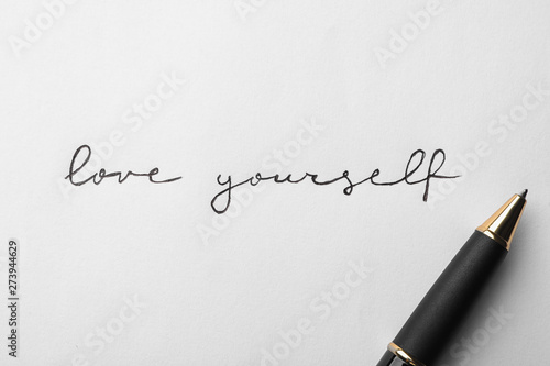 Canvas Print Written words LOVE YOURSELF and pen on white background, top view