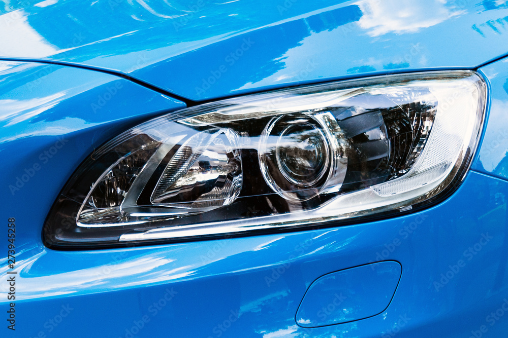 Modern car headlight, Blue car exterior detail