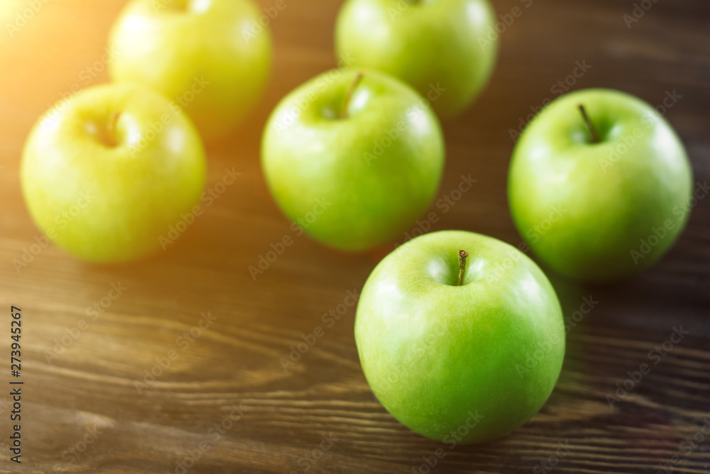 Group of green apples on brown wooden background. Close up Group of green apples on brown wooden background. Close up