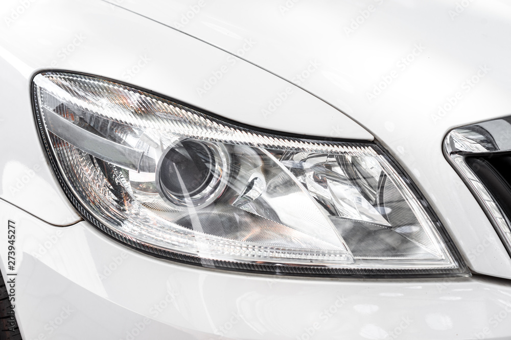 Modern car headlight, car exterior detail