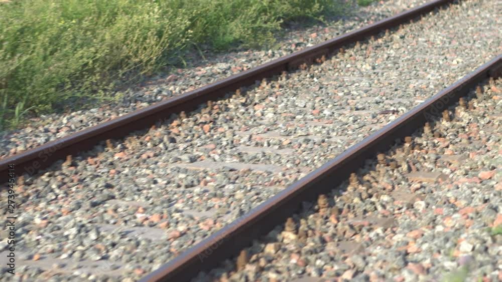 Railway rails and sleepers in summer sunny day. Close-up. Railroad track Railway rails and sleepers in summer sunny day. Close-up. Railroad track