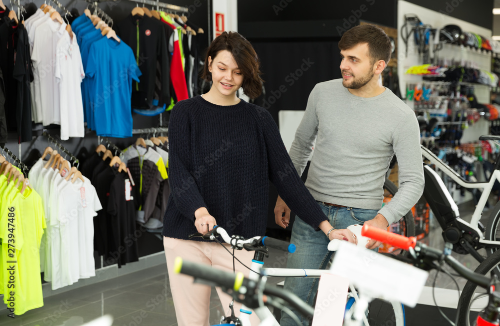  couple looking sport bicycle