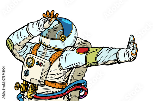 Astronaut in a spacesuit. Gesture of denial, shame, no