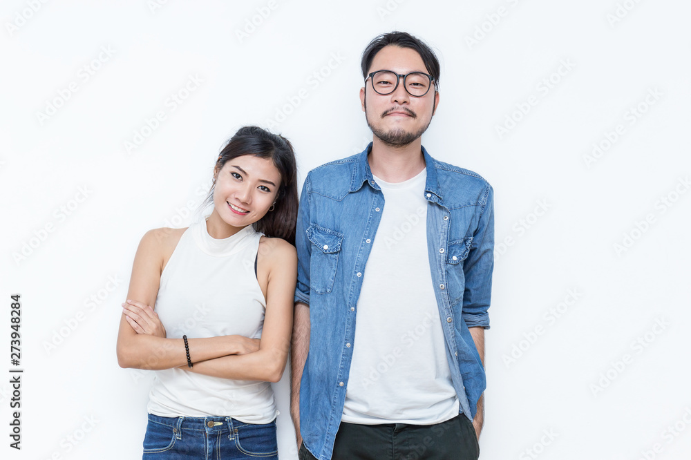 Portrait of happy young couple smiling isolated on white background. Young asian man woman couple have fun, Family love modern lifestyle multicultural diversity people concept Portrait of happy young couple smiling isolated on white background. Young asian man woman couple have fun, Family love modern lifestyle multicultural diversity people concept