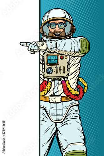 man astronaut. Point to copy space poster