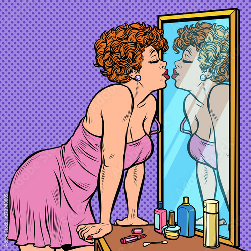 woman in nightgown kissing her reflection in the mirror