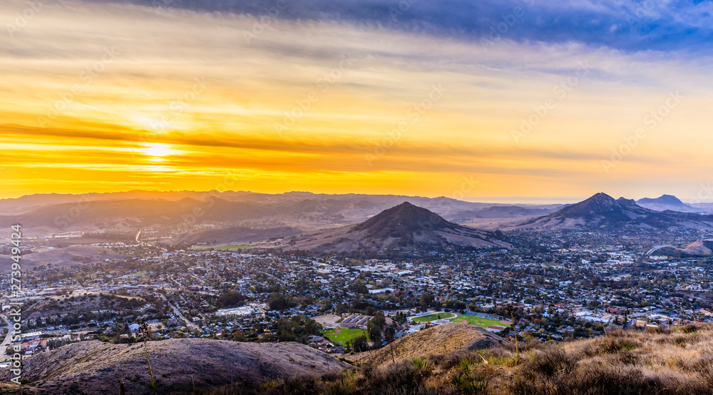Yellow sunset over Mountains and Cityscape