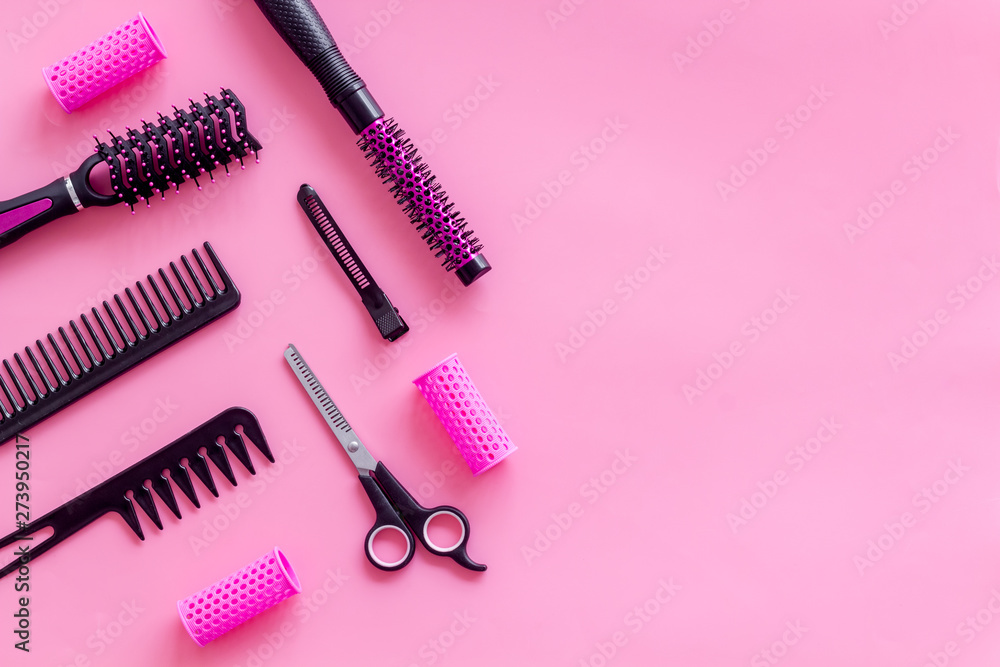 Set of professional hairdresser tools with combs and sciccors on pink background top view mock up Set of professional hairdresser tools with combs and sciccors on pink background top view mock up
