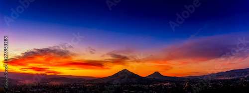 Panorama of Mountains Silhouetted against Sunset Sky © Mark