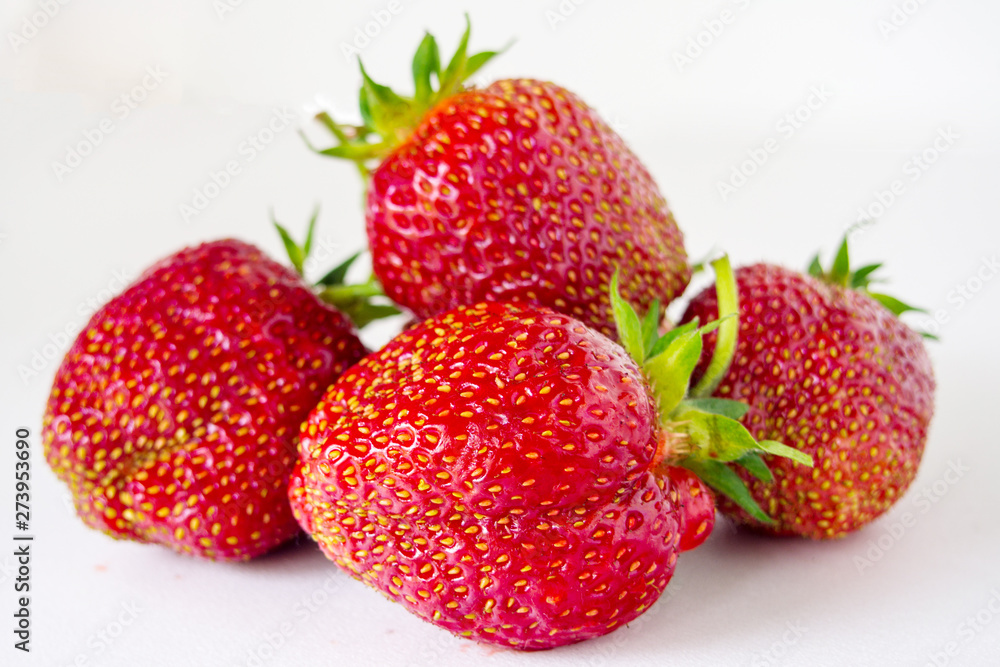 four big fresh strawberries on white background four big fresh strawberries on white background