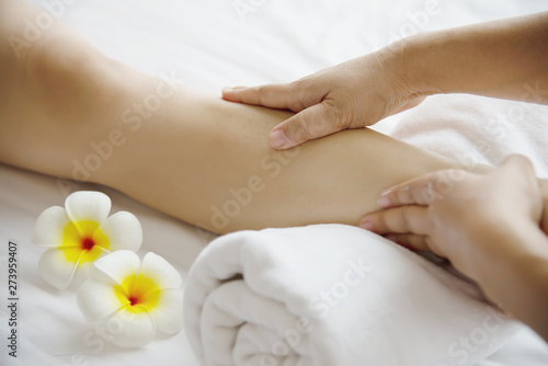 Fototapeta Naklejka Na Ścianę i Meble -  Woman receiving foot massage service from masseuse close up at hand and foot - relax in foot massage therapy service concept