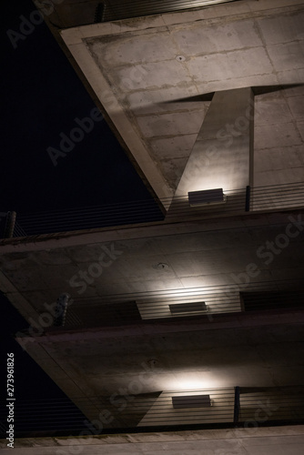 Concrete parking structure illuminated at night