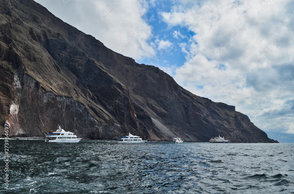 Line of Boats Near Cliff in the Galapagos Islands Ecuador