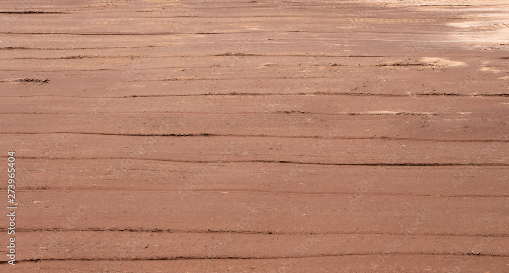 Fototapeta premium Stripes left by the earth pavement pressed by the roller