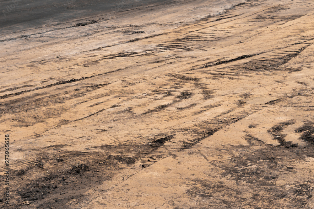 Construction pavement with many wheel prints Construction pavement with many wheel prints