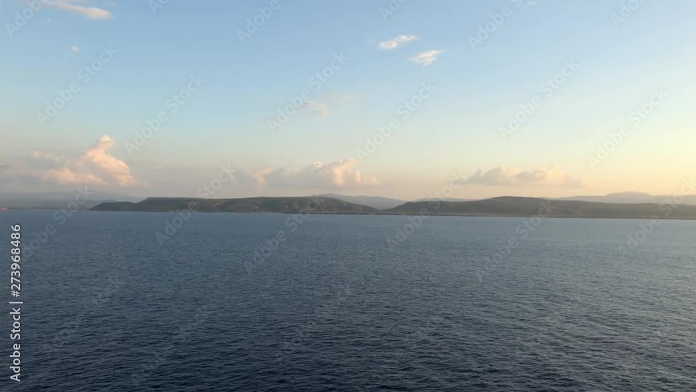 Island view in the distance from the ocean. Island view in the distance from the ocean.