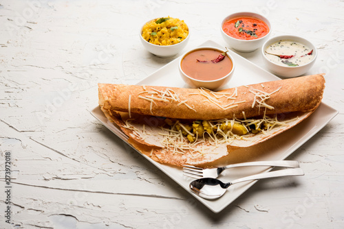 cheese masala dosa recipe with sambar and chutney, selective focus photo