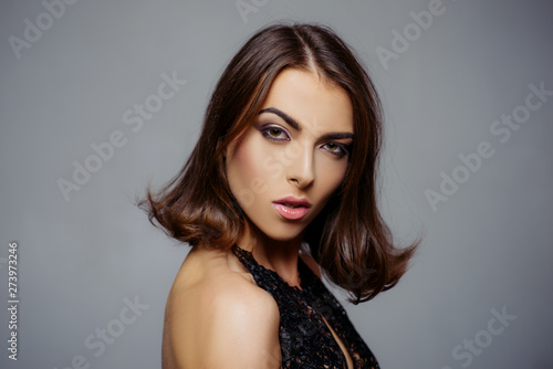 Beauty woman face. Pretty girl with perfect skin. Hairstyle styling. Fashion, beauty, cosmetics. Makeup, smooth skin. Advertisement, magazine.