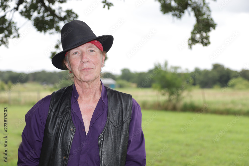 Portrait of middle aged white male out in wide open countryside. Portrait of middle aged white male out in wide open countryside.