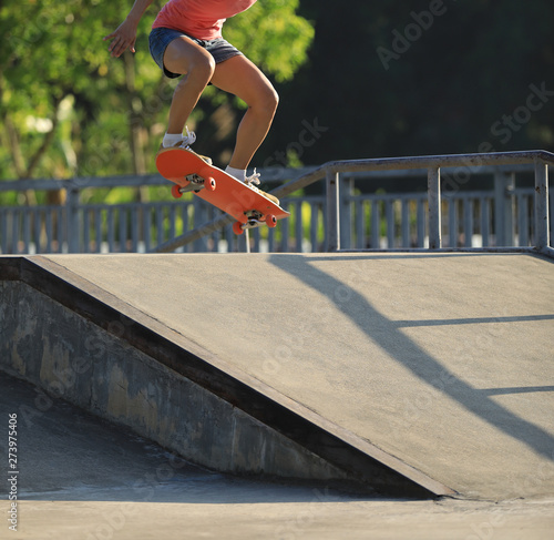 Skateboarder skateboarding on skate park