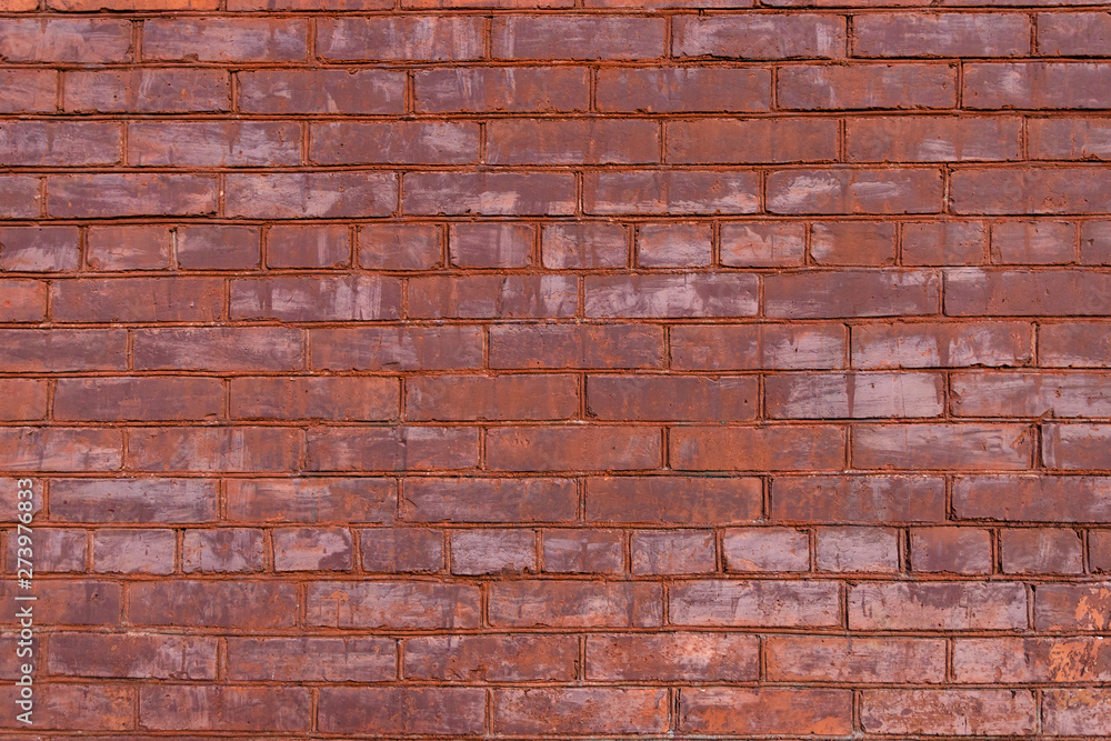 Old red painted brick wall with beautiful rows of speckled bricks. Old red painted brick wall with beautiful rows of speckled bricks.