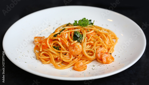 Spaghetti with shrimps and tomato sauce, italian cuisine