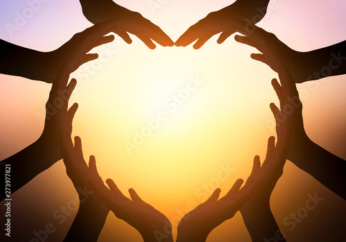 Foto International Day of Friendship concept: hands in shape of heart on blurred  bac