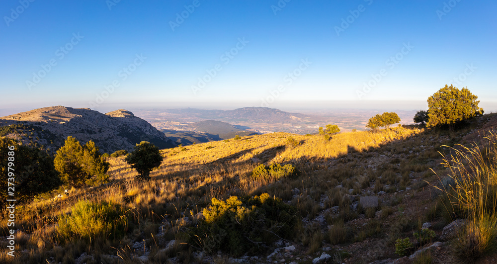 A panoramic view at sunset from the summit of Mount Morron in the Spanish region of Murcia to the north east. The mountain region is called Sierra Espuna.