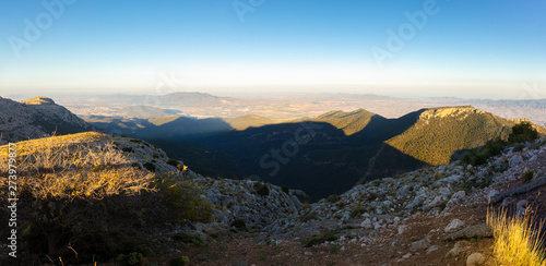 A panoramic view south to Cartagena from the summit of Morron in the Sierra Espuna mountain range in Spain. It's just before sunset.