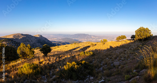 A panoramic view at sunset from the summit of Mount Morron in the Spanish region of Murcia to the north east. The mountain region is called Sierra Espuna.