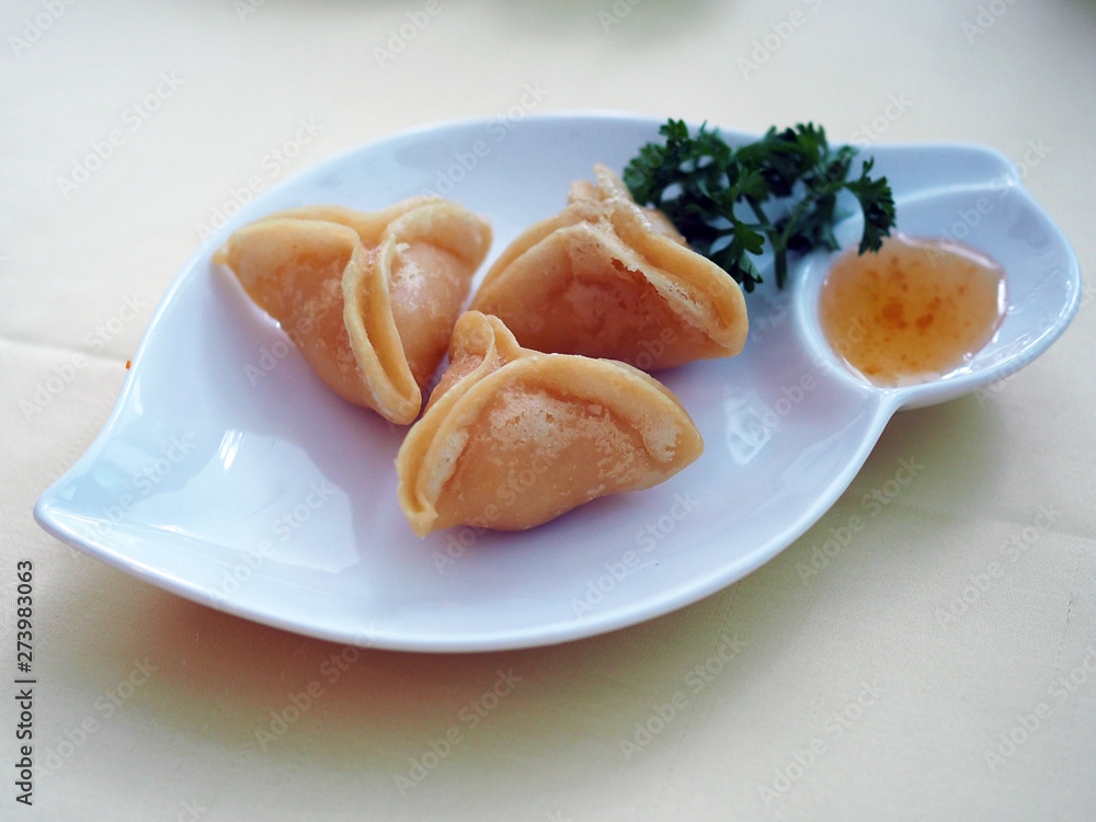 Crispy Deep fried minced shrimp in pyramid shape served with sweet and sour plum sauce. Chinese food style with selective focus. Crispy Deep fried minced shrimp in pyramid shape served with sweet and sour plum sauce. Chinese food style with selective focus.