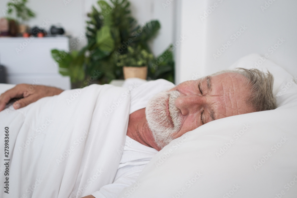senior man sleeping alone and headache or dreaming nightmare on bed in room senior man sleeping alone and headache or dreaming nightmare on bed in room