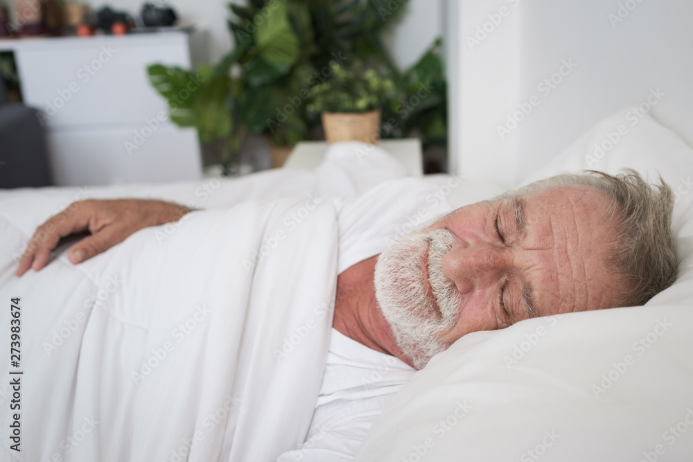 senior man sleeping alone and headache or dreaming nightmare on bed in room senior man sleeping alone and headache or dreaming nightmare on bed in room