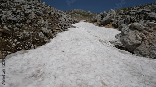 snow on the mountains of Roccaraso in summer, (plateau) Piano Aremogna and Pizzalto, Monte Greco, Monti Marsicani highest group of Apennines. L'Aquila, Abruzzo, Italy photo