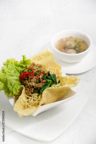 Cwie mie or cui mie, asian noodles with chicken, vegetable, and meatballs in a bowl