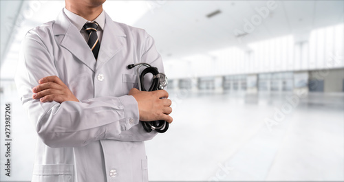 Wallpaper Mural young doctor with hospital background Torontodigital.ca
