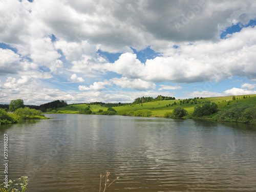 Russian landscape: field and lake