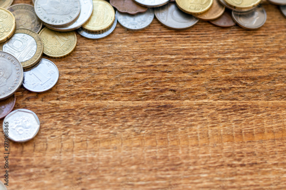 coins Pile pack heap on a wooden background with space for an inscription copy space mock up selective focus close up coins Pile pack heap on a wooden background with space for an inscription copy space mock up selective focus close up