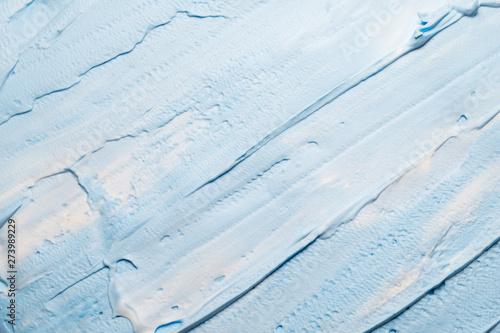 Sky blue acrylic paint. Creative abstract background. Closeup of brushstrokes texture surface.