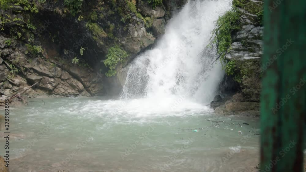 Natural waterfall in Himalayas with crustal clear water, in between the forest and Himalayas mountains. Upper Himalayas, Uttarakhand , India.Tiger Fall,Mussoorie,Rispana River. Natural waterfall in Himalayas with crustal clear water, in between the forest and Himalayas mountains. Upper Himalayas, Uttarakhand , India.Tiger Fall,Mussoorie,Rispana River.