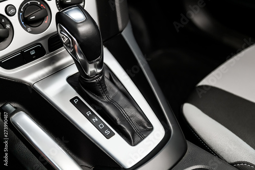 Close-up of the accelerator handle with silver metallic.  automatic transmission gear of car , car interior photo