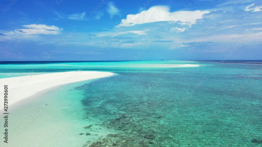 Flying low above a sandbank in shallow turquoise water. With a dramatic sky above Thailand. Dolly out, wide angle. Flying low above a sandbank in shallow turquoise water. With a dramatic sky above Thailand. Dolly out, wide angle.