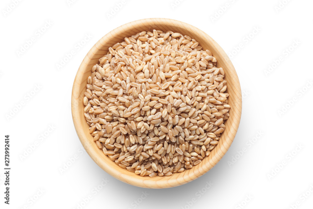 Wheat grains in a wooden bowl isolated on white background. Wheat grains in a wooden bowl isolated on white background.