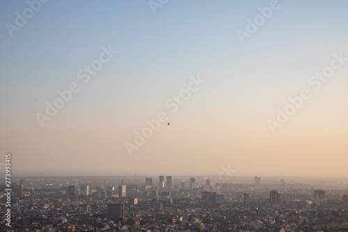 Bird flying over of the city of Barcelona and the Mediterranean sea