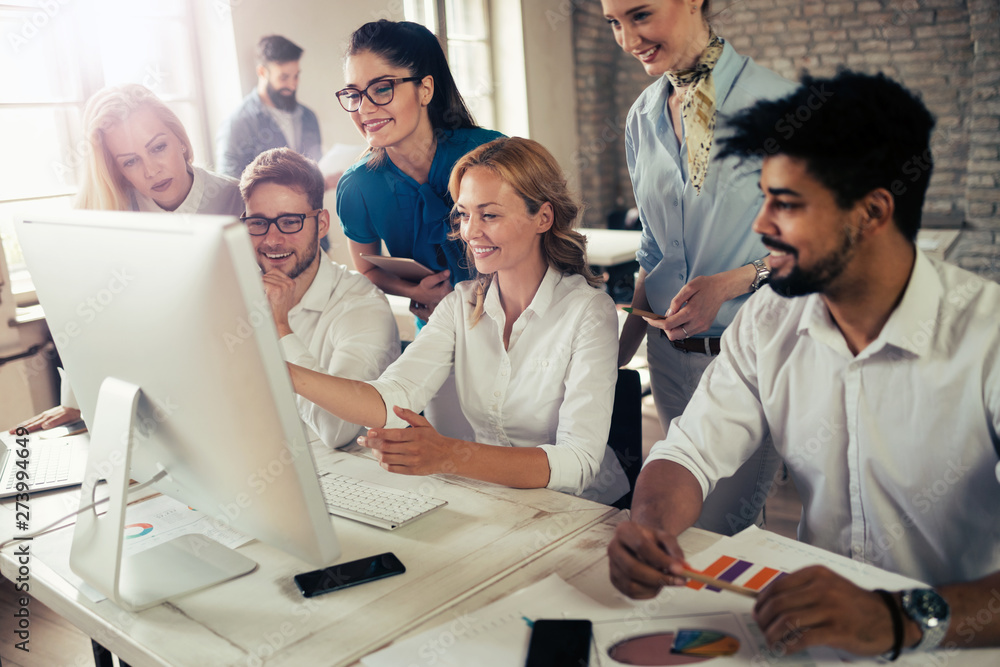 Happy creative team in office. Business, startup, design, people and teamwork concept Happy creative team in office. Business, startup, design, people and teamwork concept